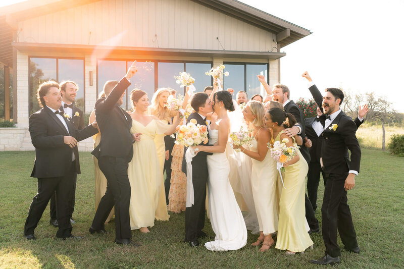 couple surrounded by their bridal party celebrating