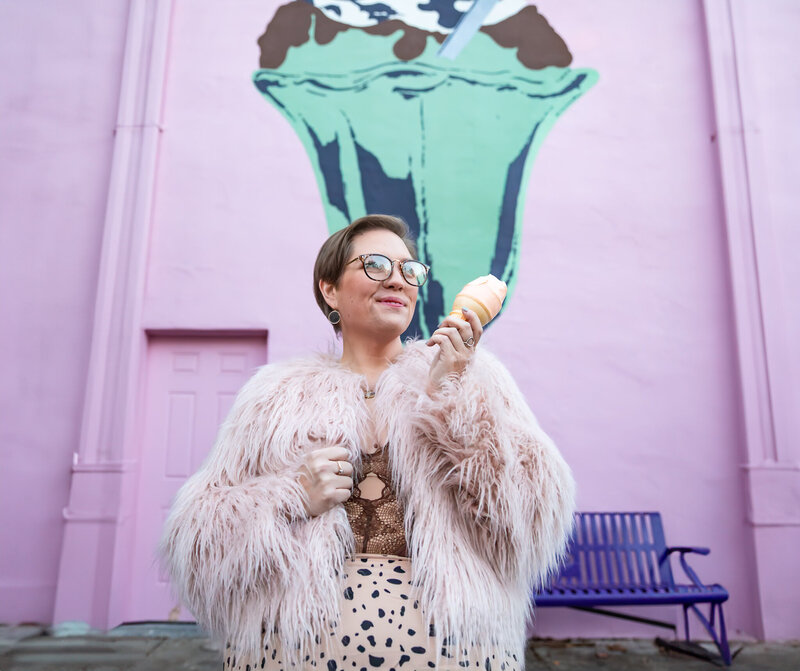 A Baltimore girl poses with ice cream for her branding Session in Fells Point.