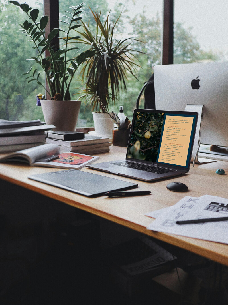 A laptop and a desktop computer on a desk, featured on a nutritionist website, showcasing digital tools for health professionals.