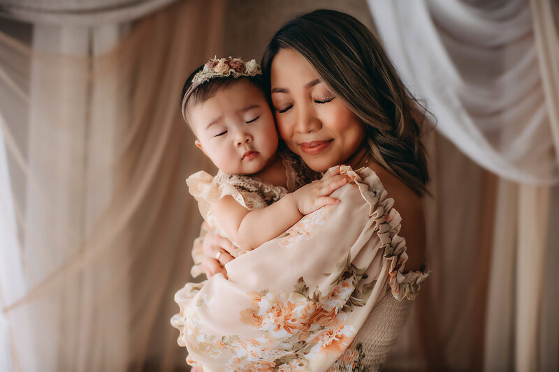 Pregnant mom posing for maternity photos at Paula Goforth's boho studio, in Fort Worth, surrounded by earthy tones and natural textures.