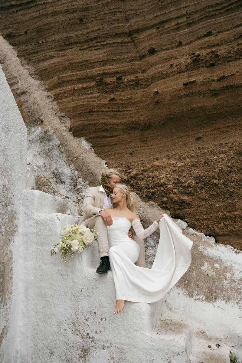 Elopement in Santorini featuring the Aegean sea