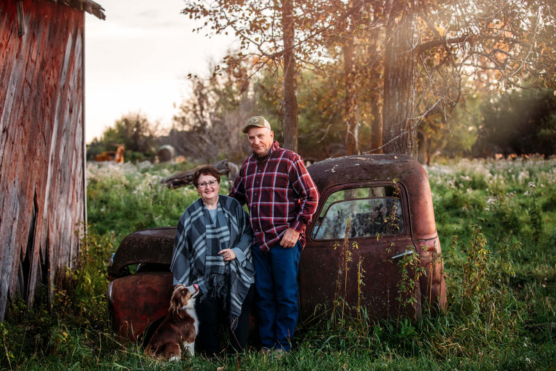 couple and their dog with vintage truck