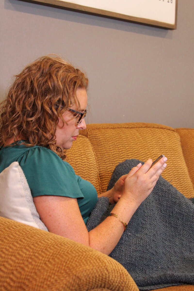 Mary Beth Lynn, Systems and Assistants Mentor for Travel Advisors, working on her gold couch