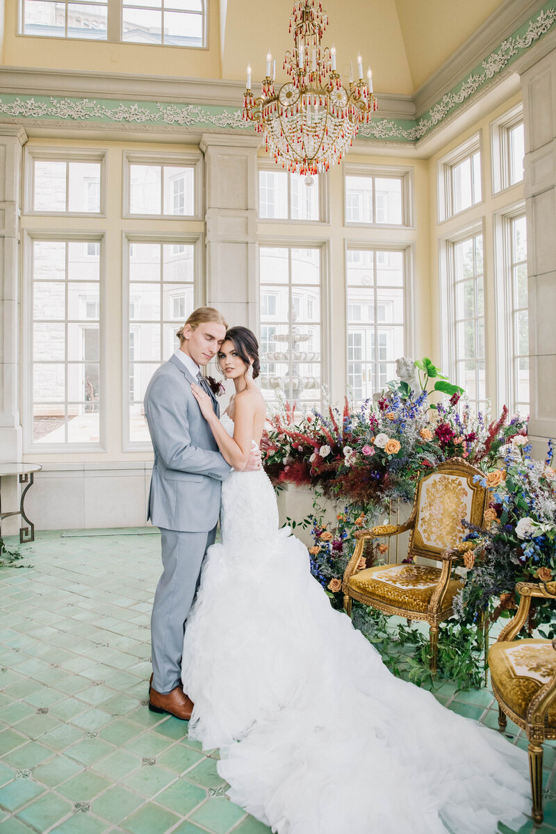 Classic modern wedding at the Olana with abundant flowers designs with gold touches in green room of The Olana. 