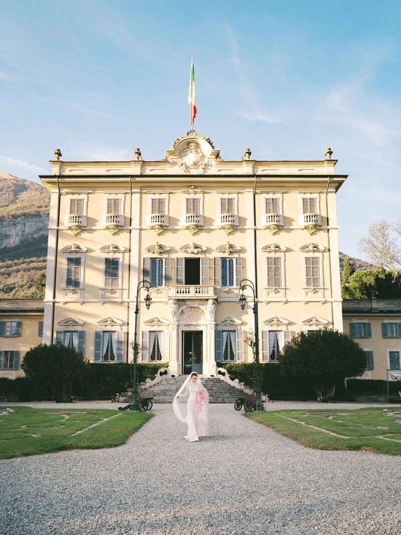 Bride towards ceremony, in front of villa Sola Cabiati in Lake Como by Lake Como wedding Photographer Andreas K. Georgiou