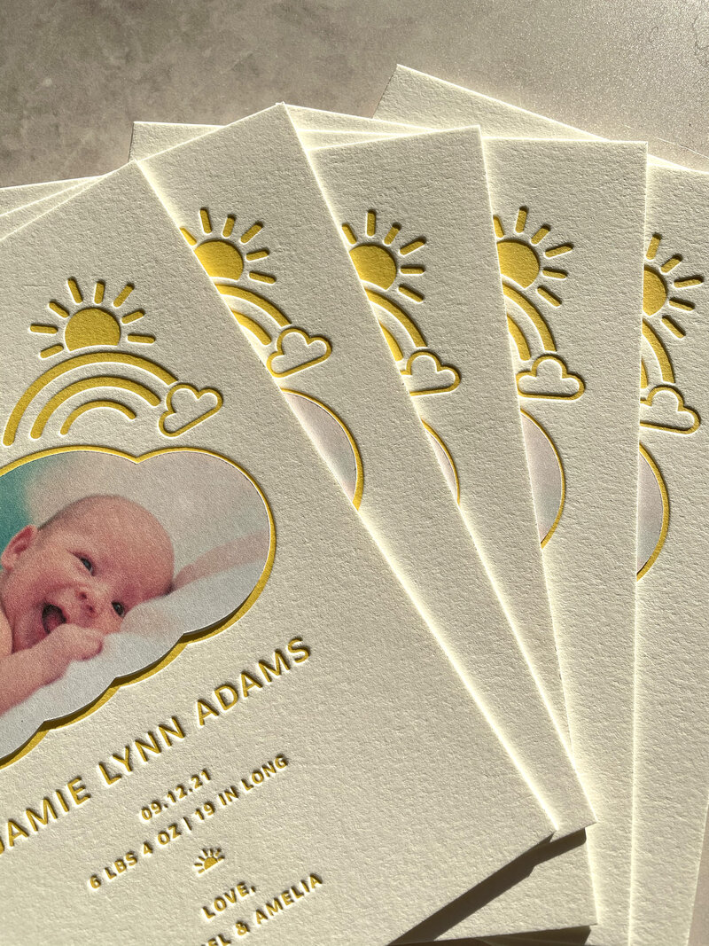 sunny illustrations on a birth announcement