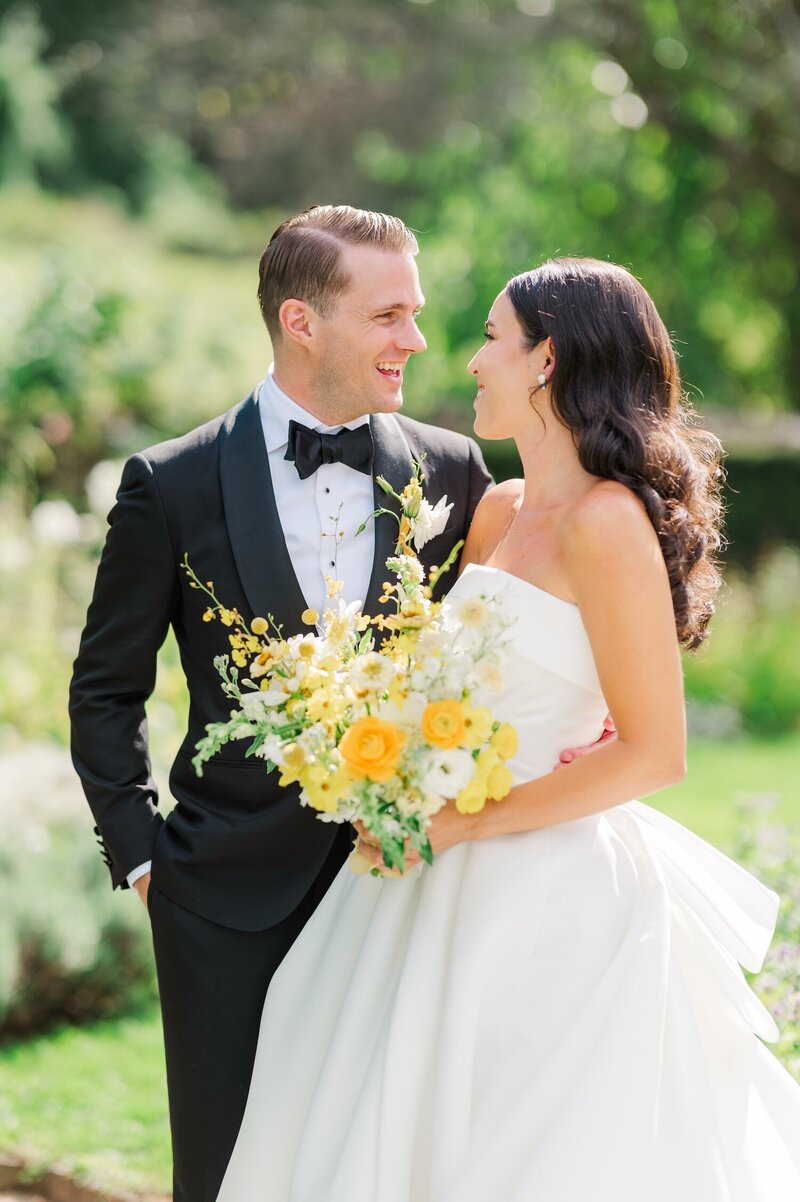 A bride and groom smile at one another lovingly at Hill-Stead Inn in Connecticut. 