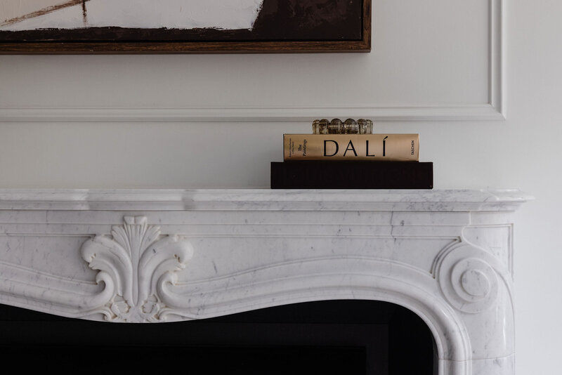 Hand-carved marble mantel detail