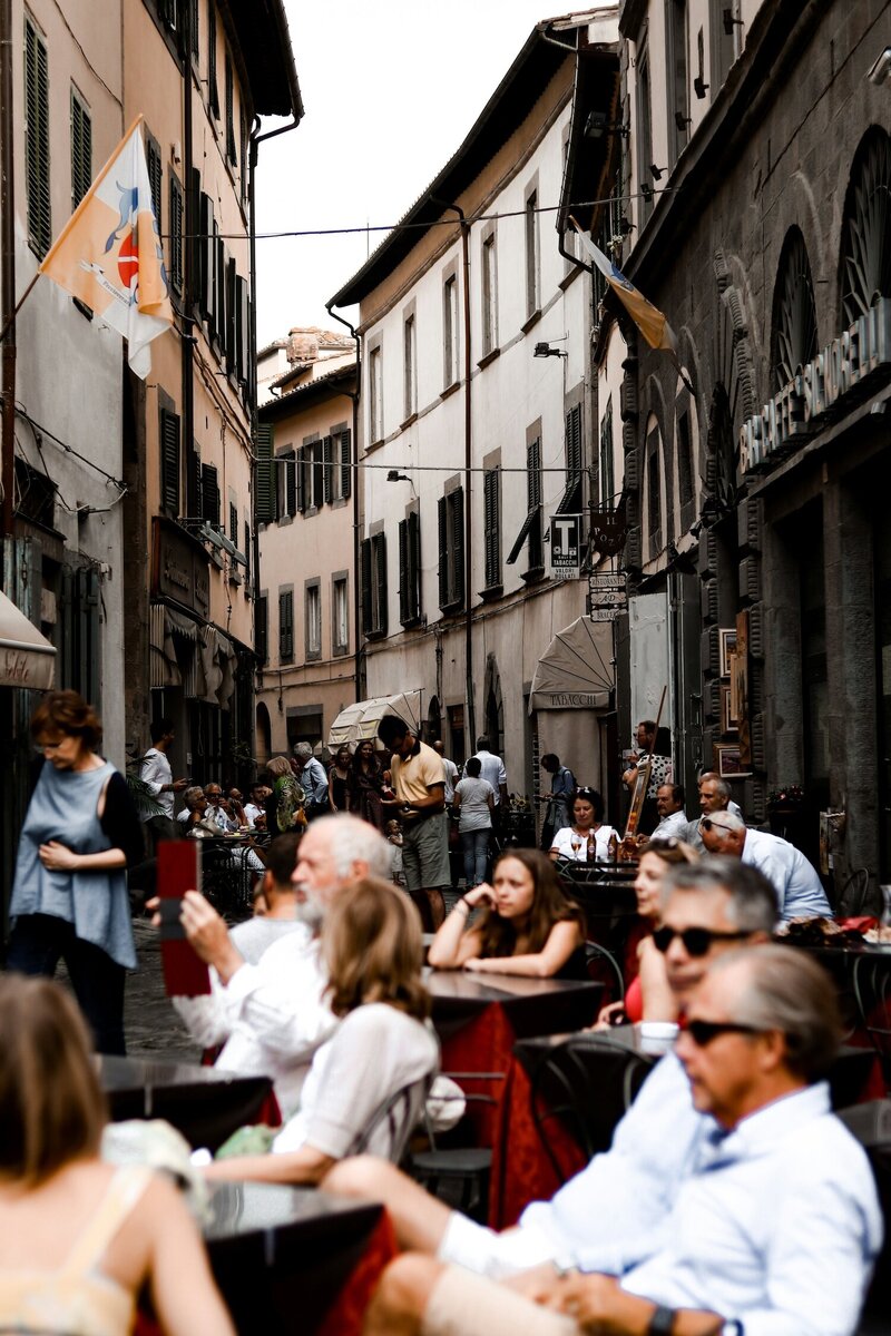 people at a cafe in Italy