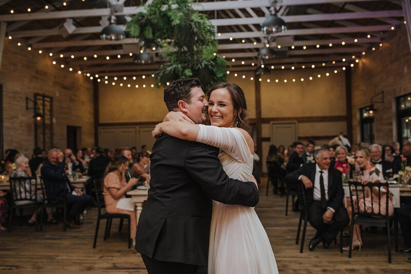 A couple hugging during their first dance