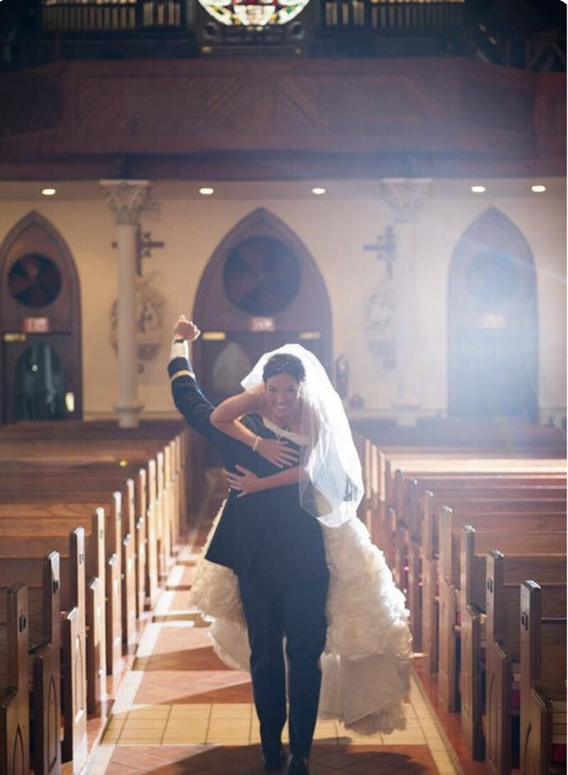 Couple at St. Michael's Cathedral after Ceremony  and then having reception at  the Venue Palafox Wharf Waterfront Pensacola, FL  Best Wedding Venue on Palafox