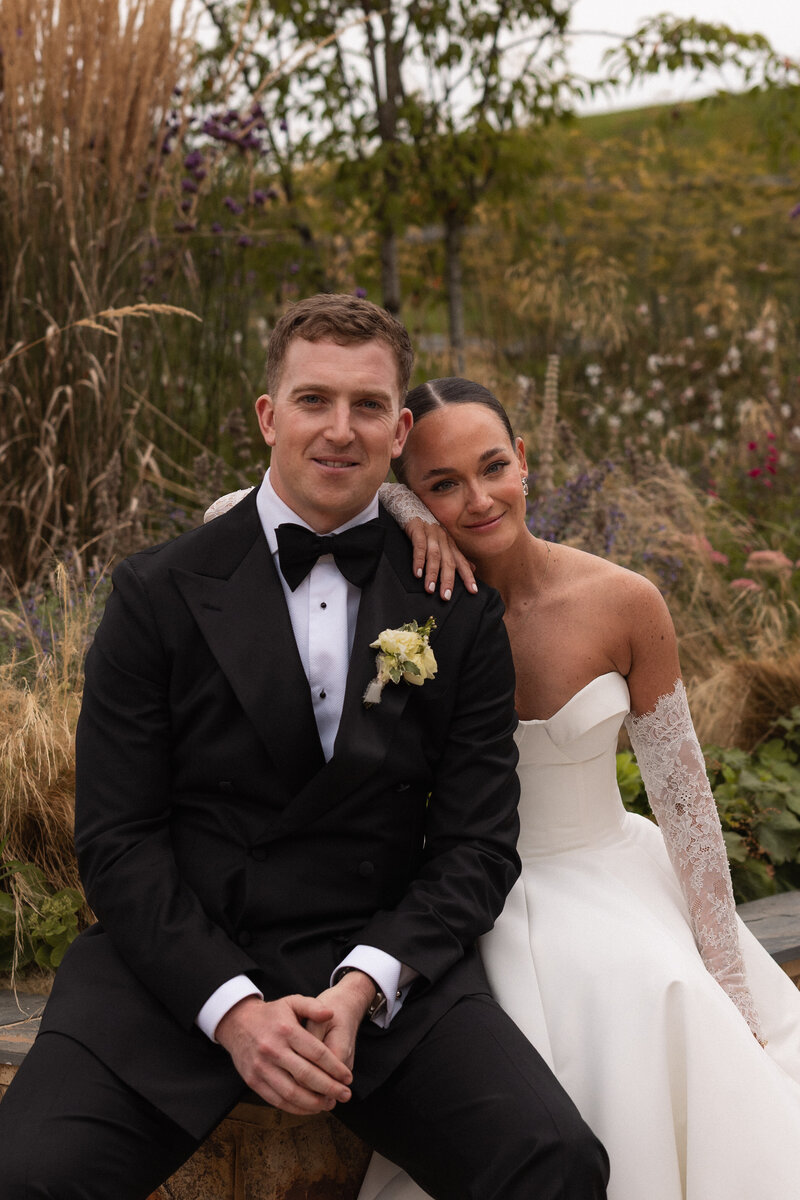 Wedding photographer captures couple taking a stroll hand in hand at their french chateau wedding.