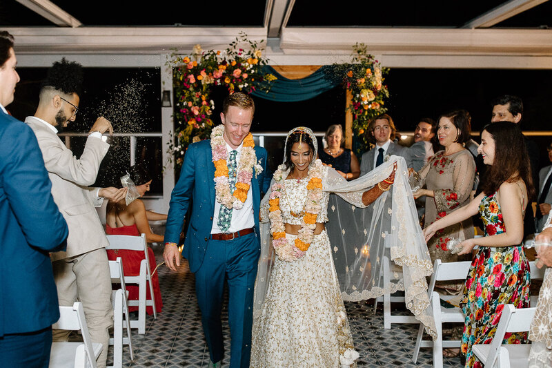 just married husband and wife celebrate by friends and family at the confidante miami beach