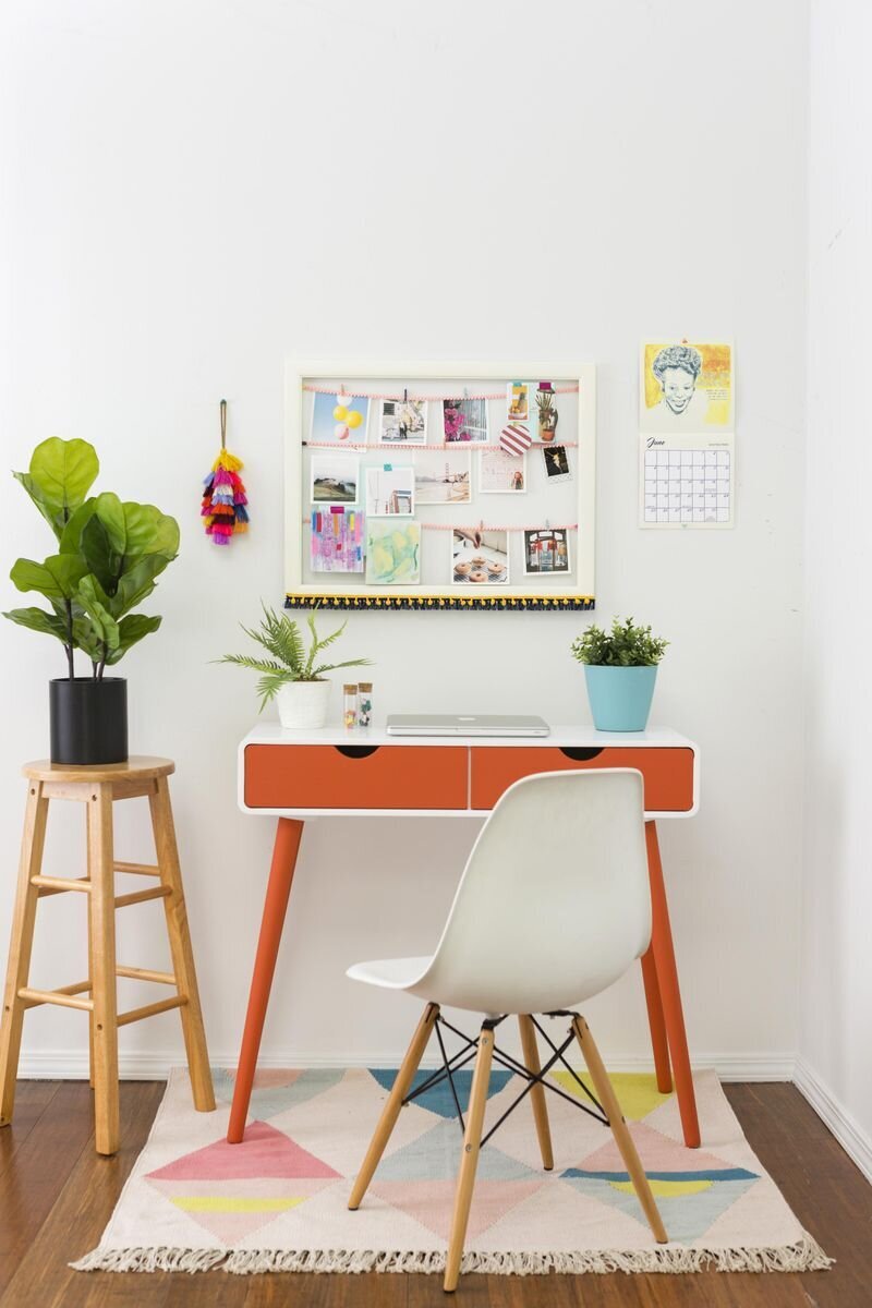 At-home office set up with table, chair, and fiddle leaf fig