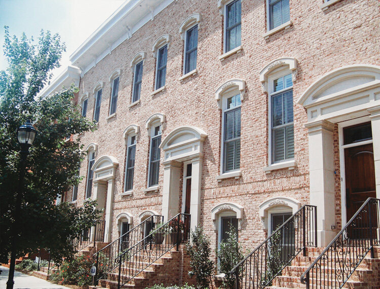 Browntone style townhomes with elegant entryways and front door surrounds