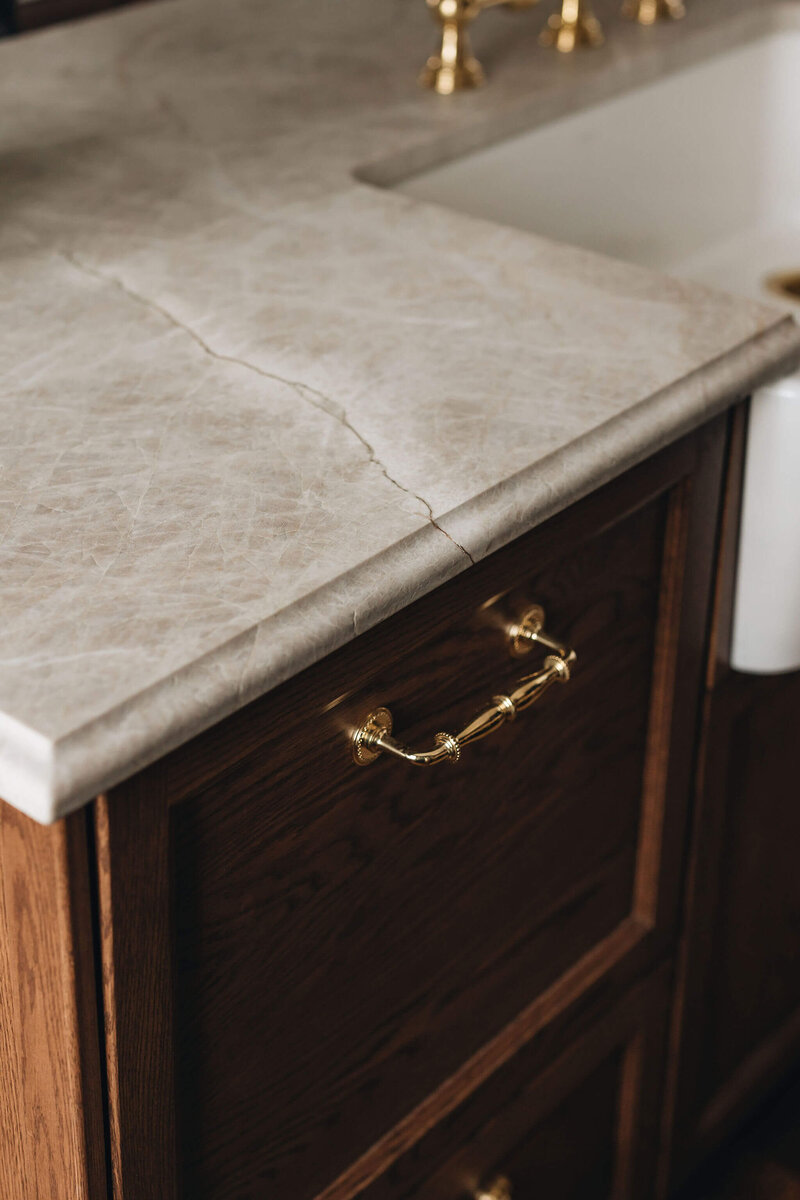High-end quartzite countertops with brass finishes