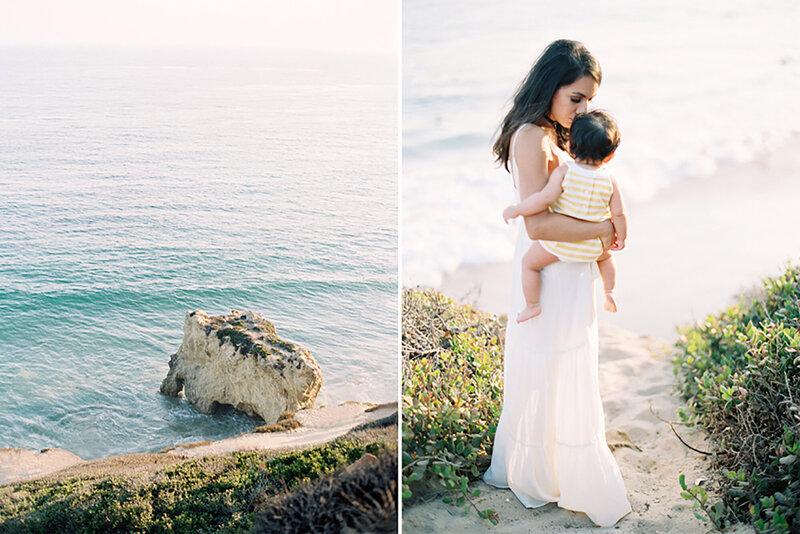 A mom holds her baby girl overlooking the ocean in Malibu