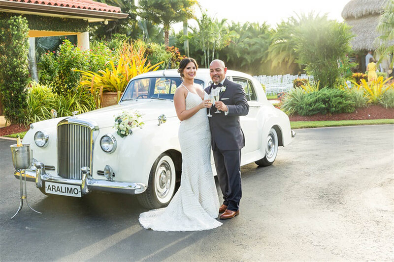 Couple Pose for Champagne Toast | Miami Wedding Photography Prices