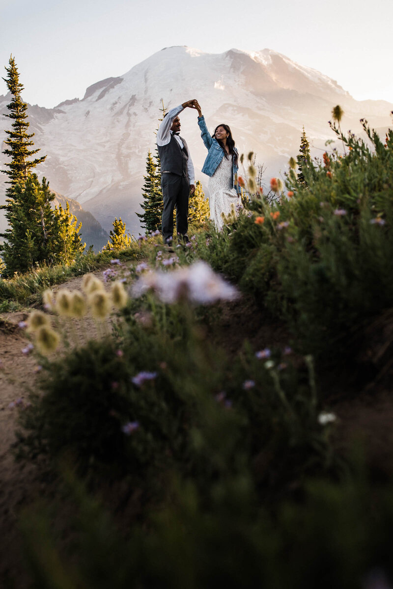 A couple dances in front of Mount Rainier