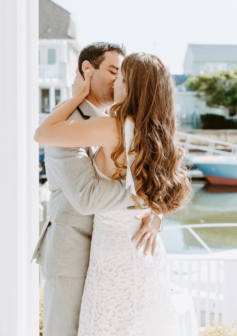 bride and groom kissing after first look at their Laguna Beach micro wedding