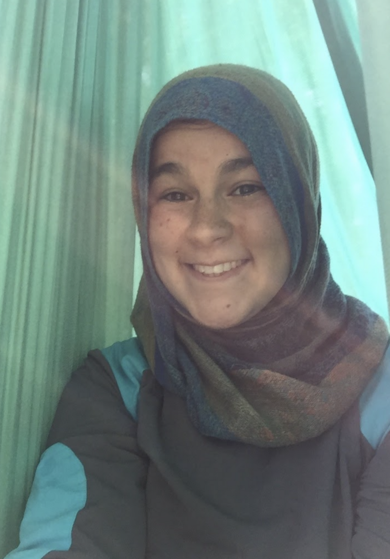 Photo of a smiling hijabi woman