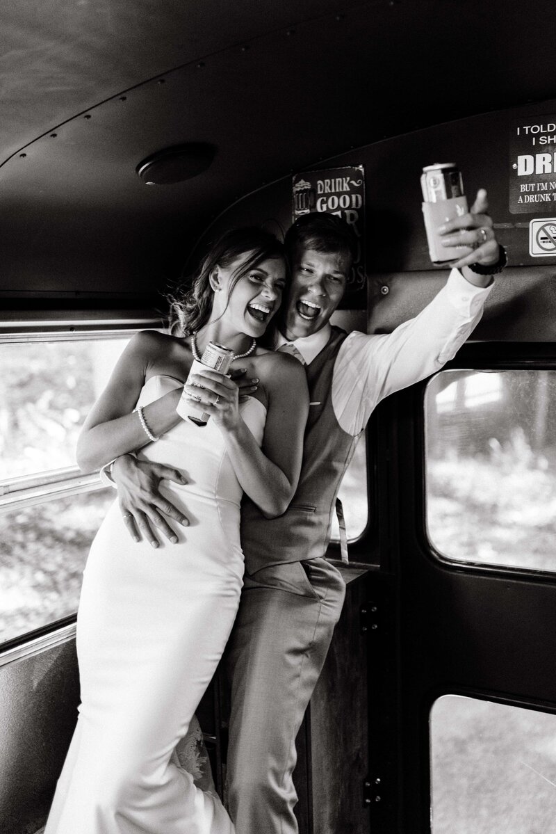 bride and groom celebrate their marriage on a party bus