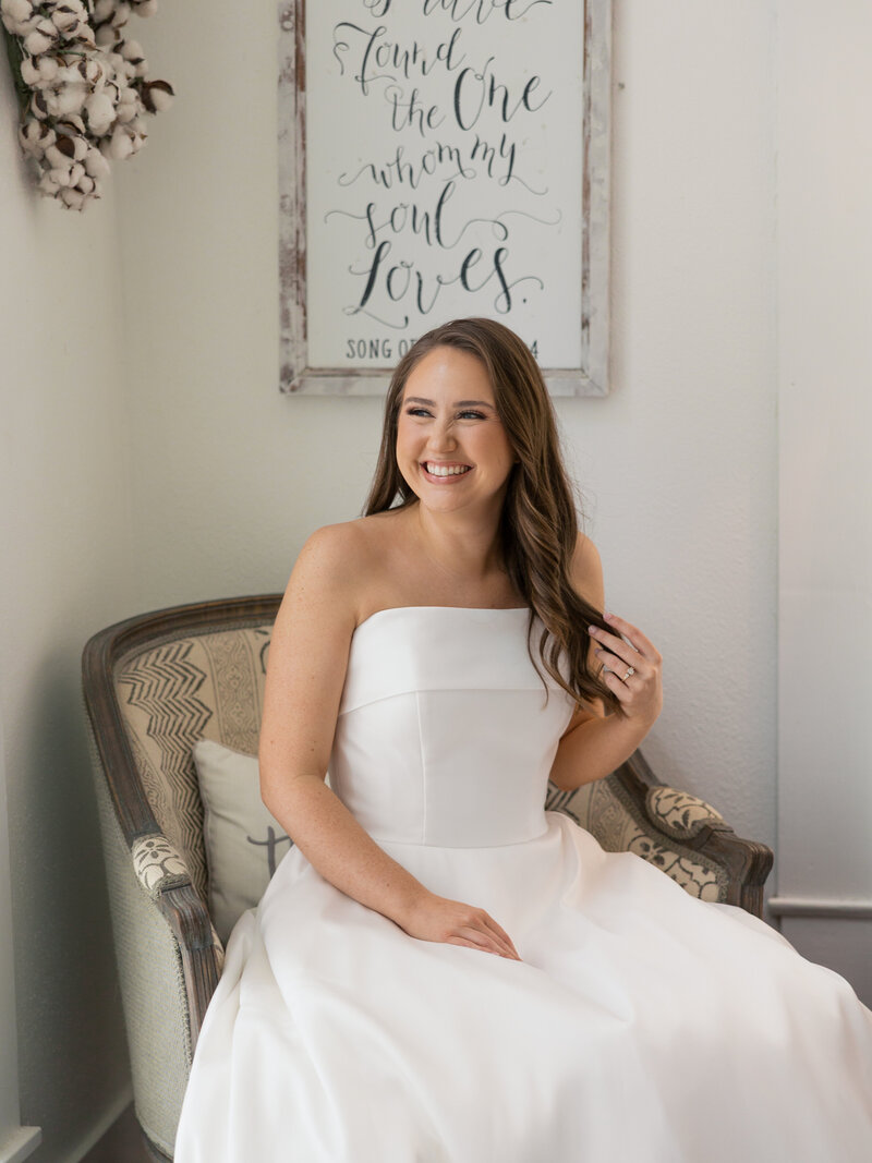 bride-laughing-out-window-at-gruene-estate