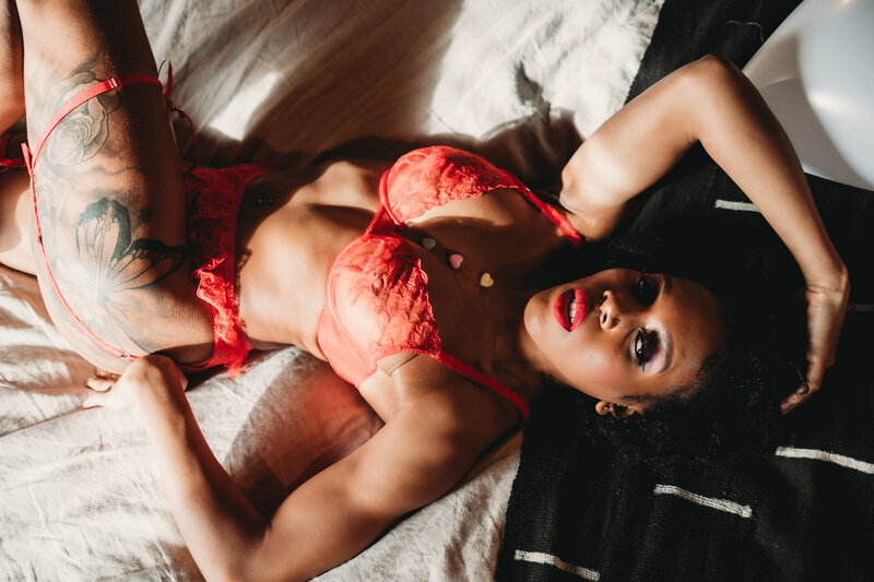 Boudoir image woman laying on bed