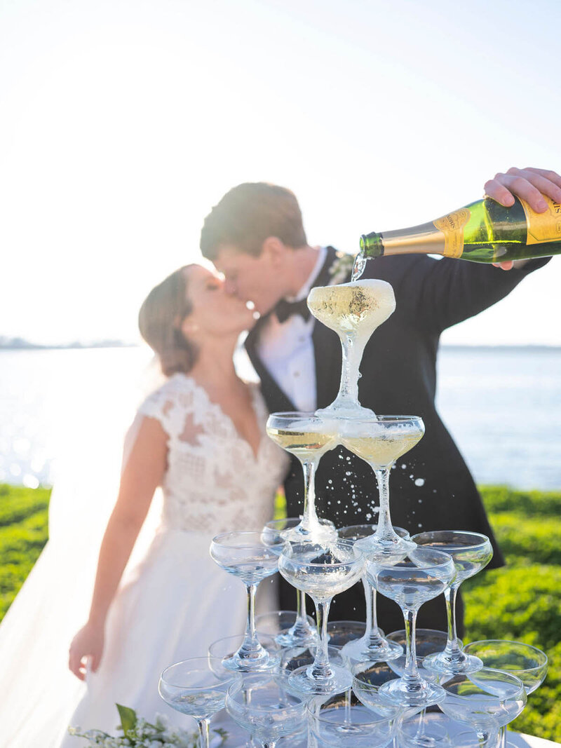 bride and groom with champagne tower