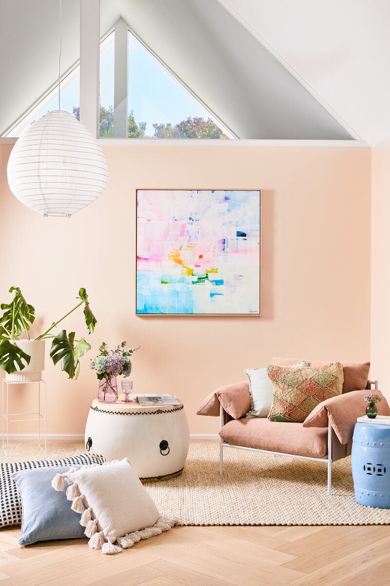 Art-filled living room styled with Melbourne interior decorator service for a creative home project.