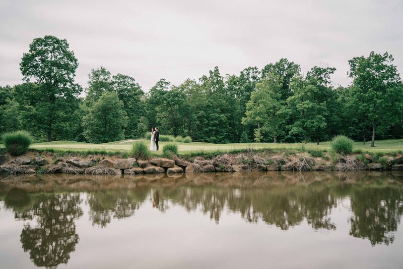 couple stand by Water,  wide scenery photo of the Westfields Golf Club 