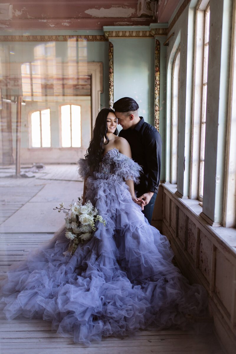 A sophisticated indoor styled shoot with soft lighting and romantic floral decor, perfect for adventurous photographers.