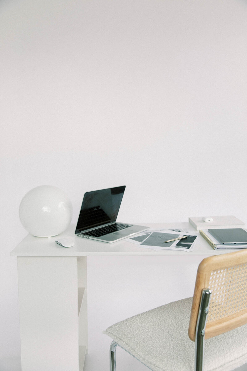 Sleek computer on a modern desk with a document open on the screen