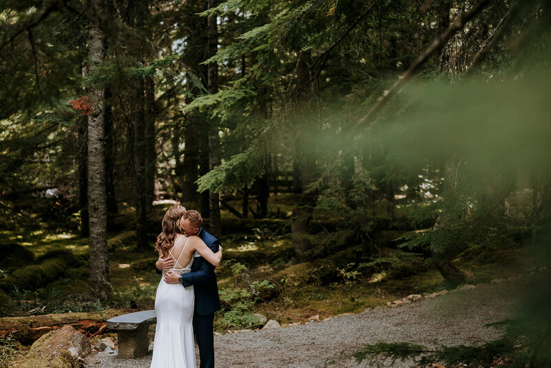 An elopement ceremony taking place at the Stone Circle in winter surrounded by snow.