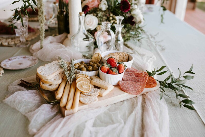 Crackers, meat, breadsticks and fruit platter
