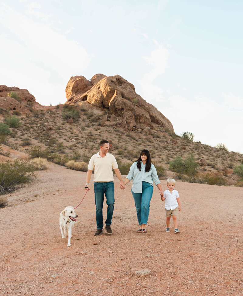 Family with toddler and dog holding hands walking in the desert Curiosity photography Meza, AZ