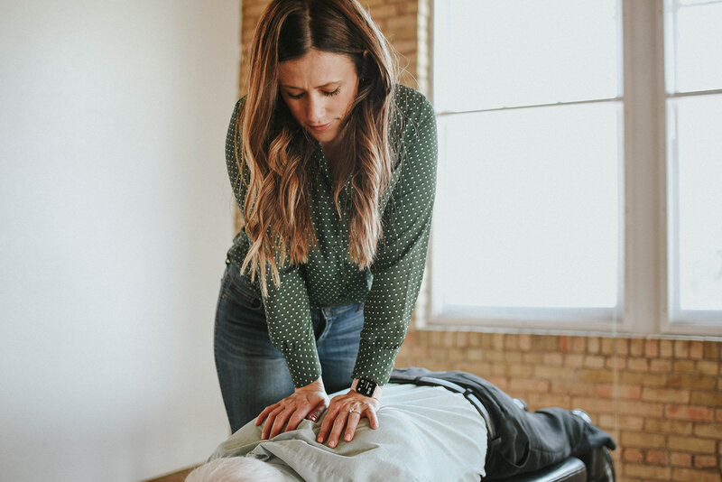 Female chiropractor adjusting a woman