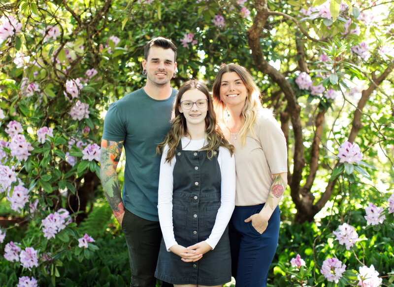Steve, Katy and their daughter smile at the camera