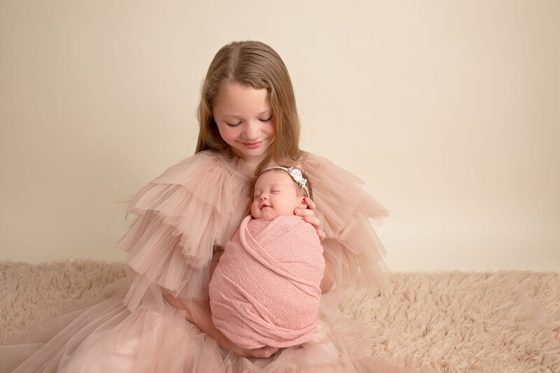 A vintage-inspired newborn session with delicate lace and soft textures, captured by a fine art newborn photographer in Peoria, AZ.