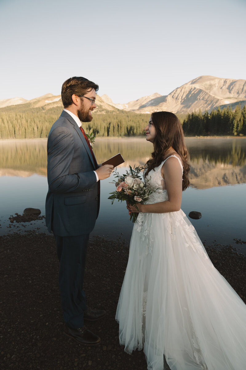 A couple says their vows at Brainard Lake in the Indian Peaks Wilderness in Colorado