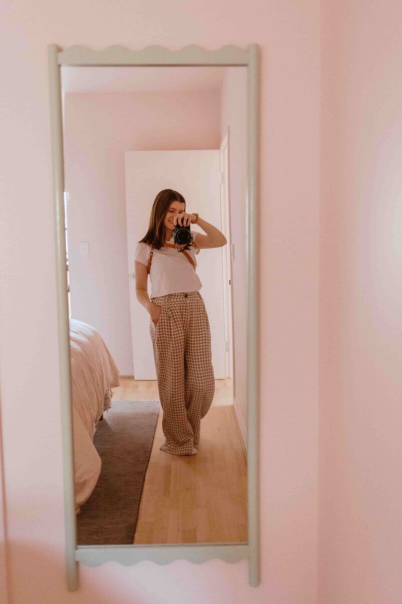 Image of kyra taking a photo of herself