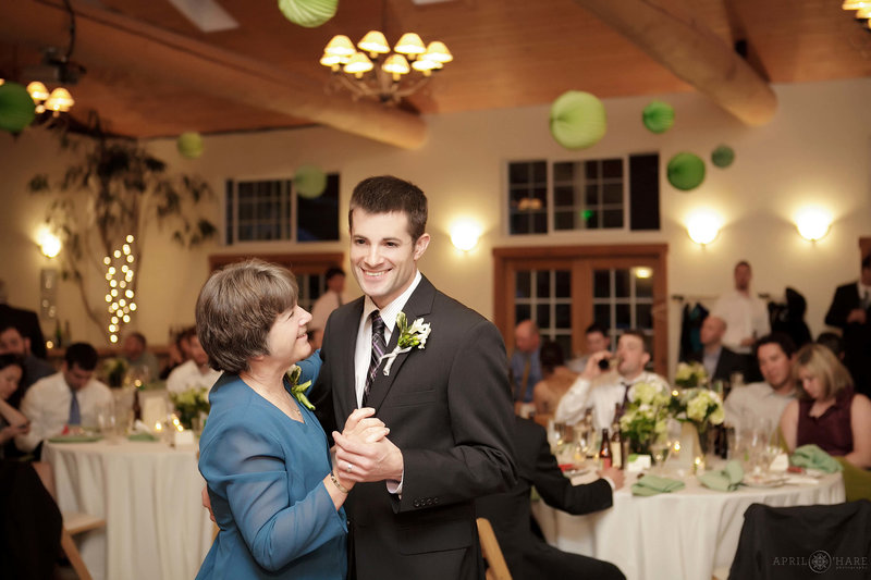 Groom dances with his mom inside the Meadow Creek Lodge & Event Center in Colorado