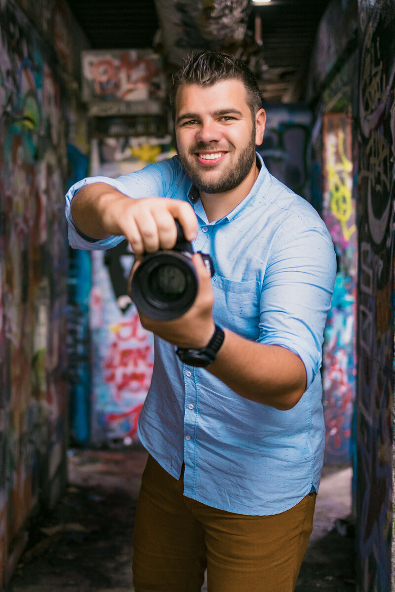 Telluride photographer Julien Kibler holding camera