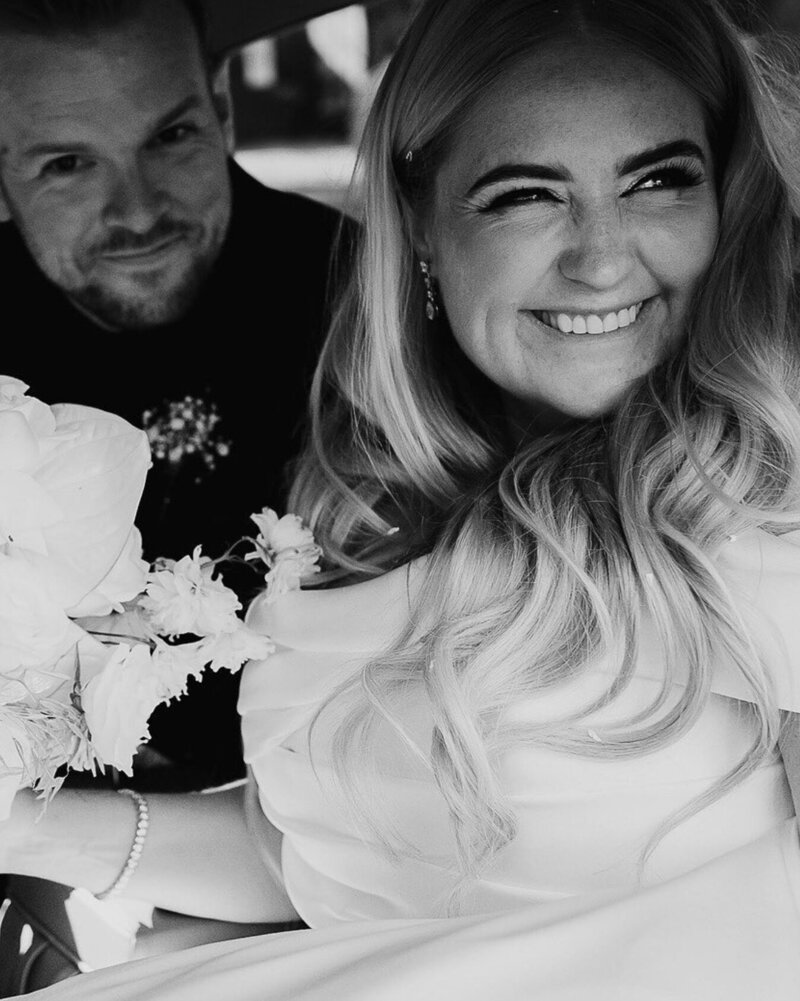 smiling-bride-in-car-with-groom