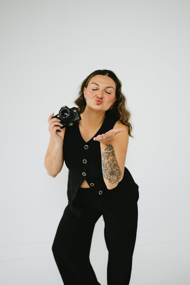 In-studio portrait of a luxury photographer crafting timeless wedding images with intentionality and heart.