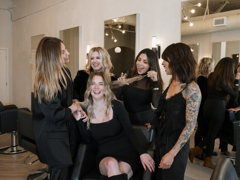 team of female hair stylists in upscale hair salon