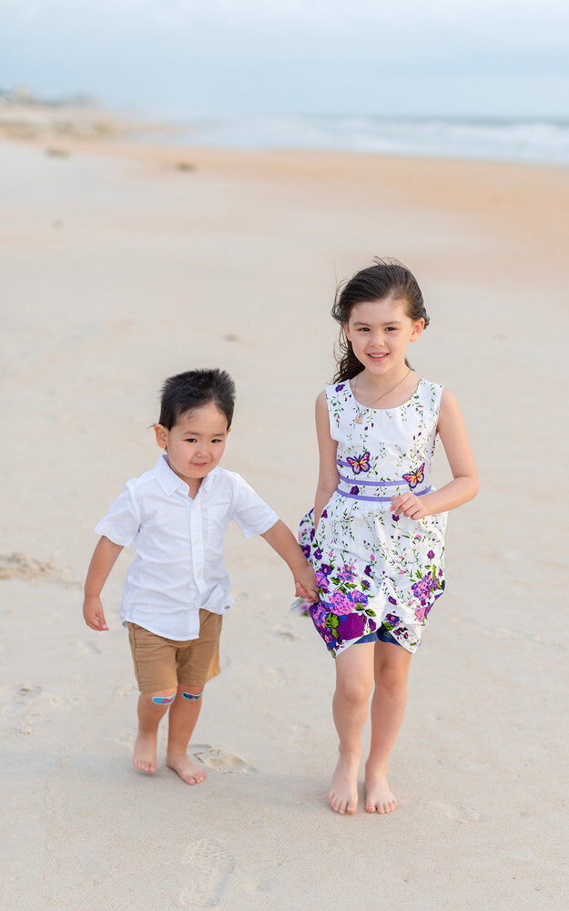 Little kiddos playing on the St Augustine beach during their photoshoot