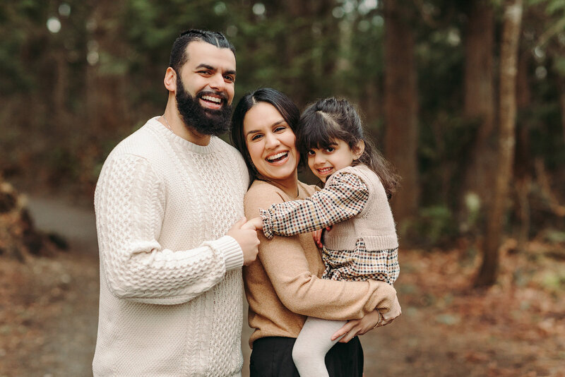 Wedding Photographers in Salt Lake capture woman holding baby during outdoor family photos