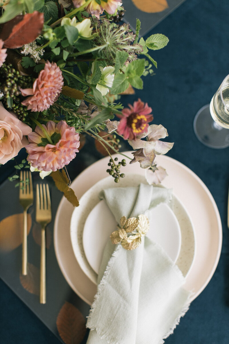 Table setting with decorative charger plate and elegant details by Kendra’s Events.