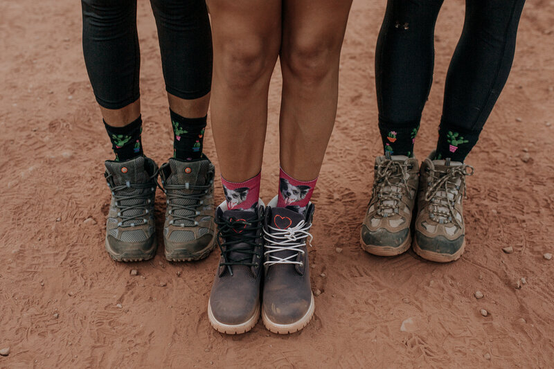 mathcing socks to hike in for their elopement in sedona